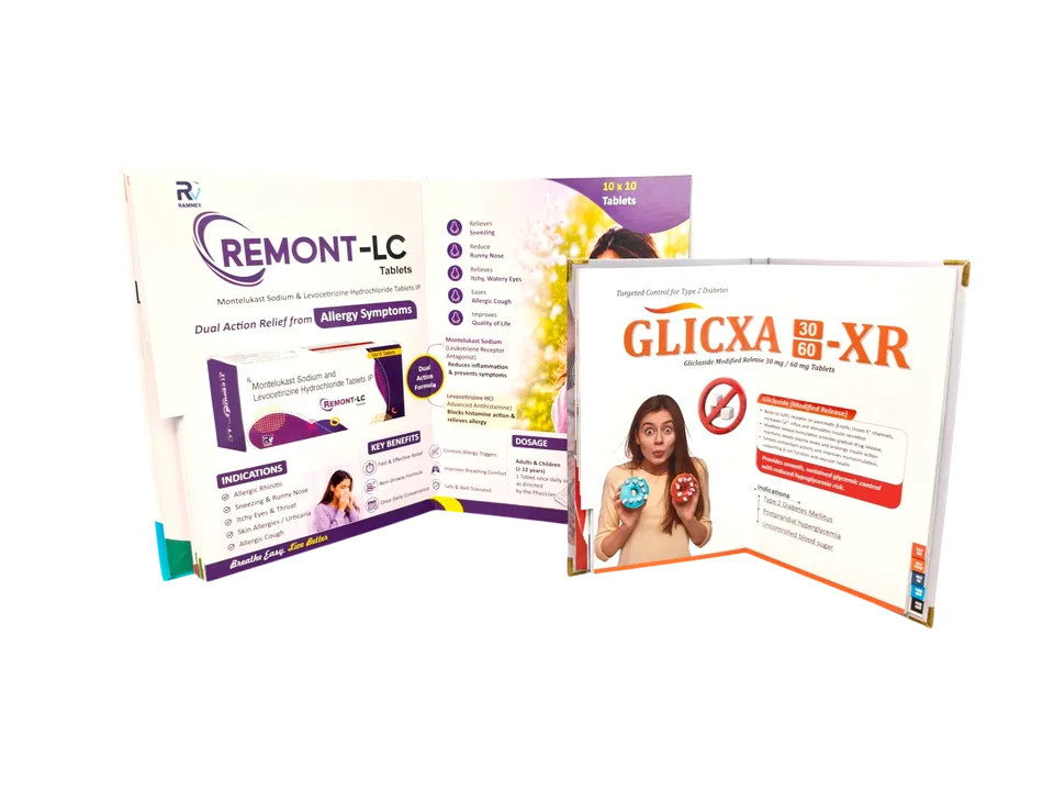 Open hardbound pharma visual aid spreads with clinical product information and index tabs